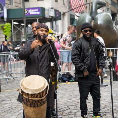 Nkumu Katalay playing his drum at New York Square
