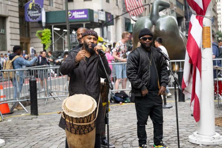 Nkumu Katalay playing his drum at New York Square